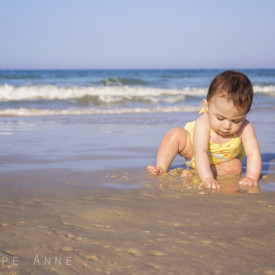 Baby playing in sand in Daytona Beach Florida.