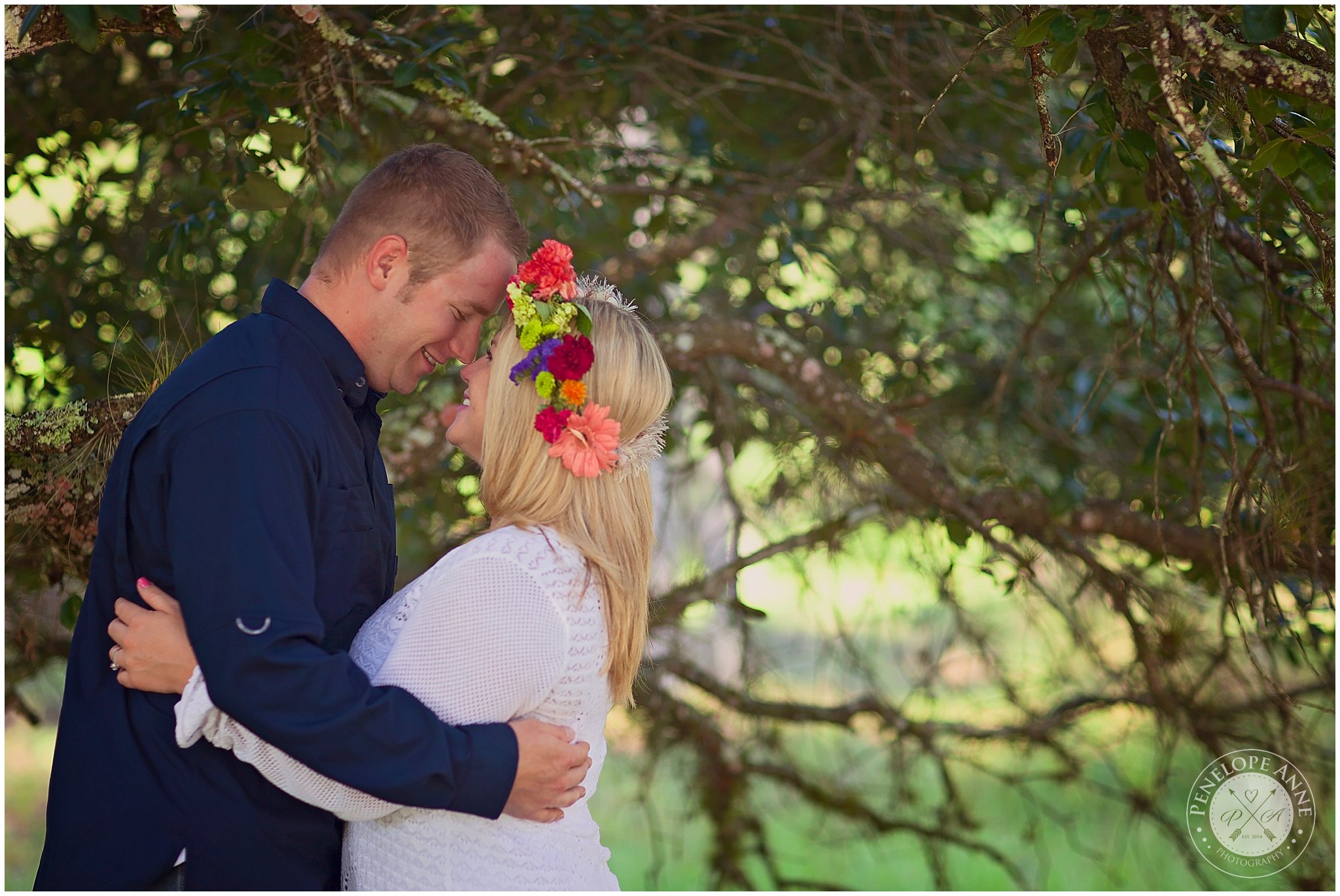 Bride and Groom touching heads at moss park engagement session.