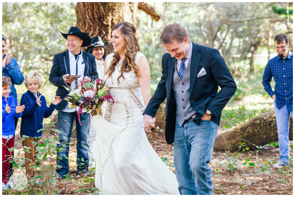 The newlyweds walking down the aisle.