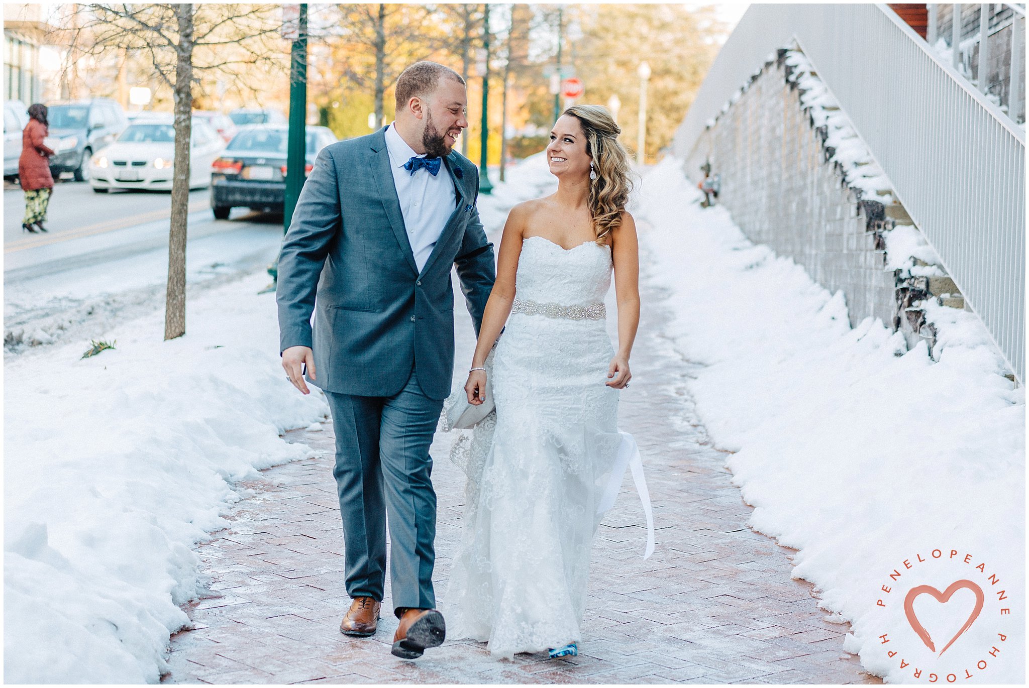 bride and groom walking outside wedding venue