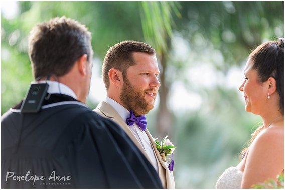 groom gazing at bride