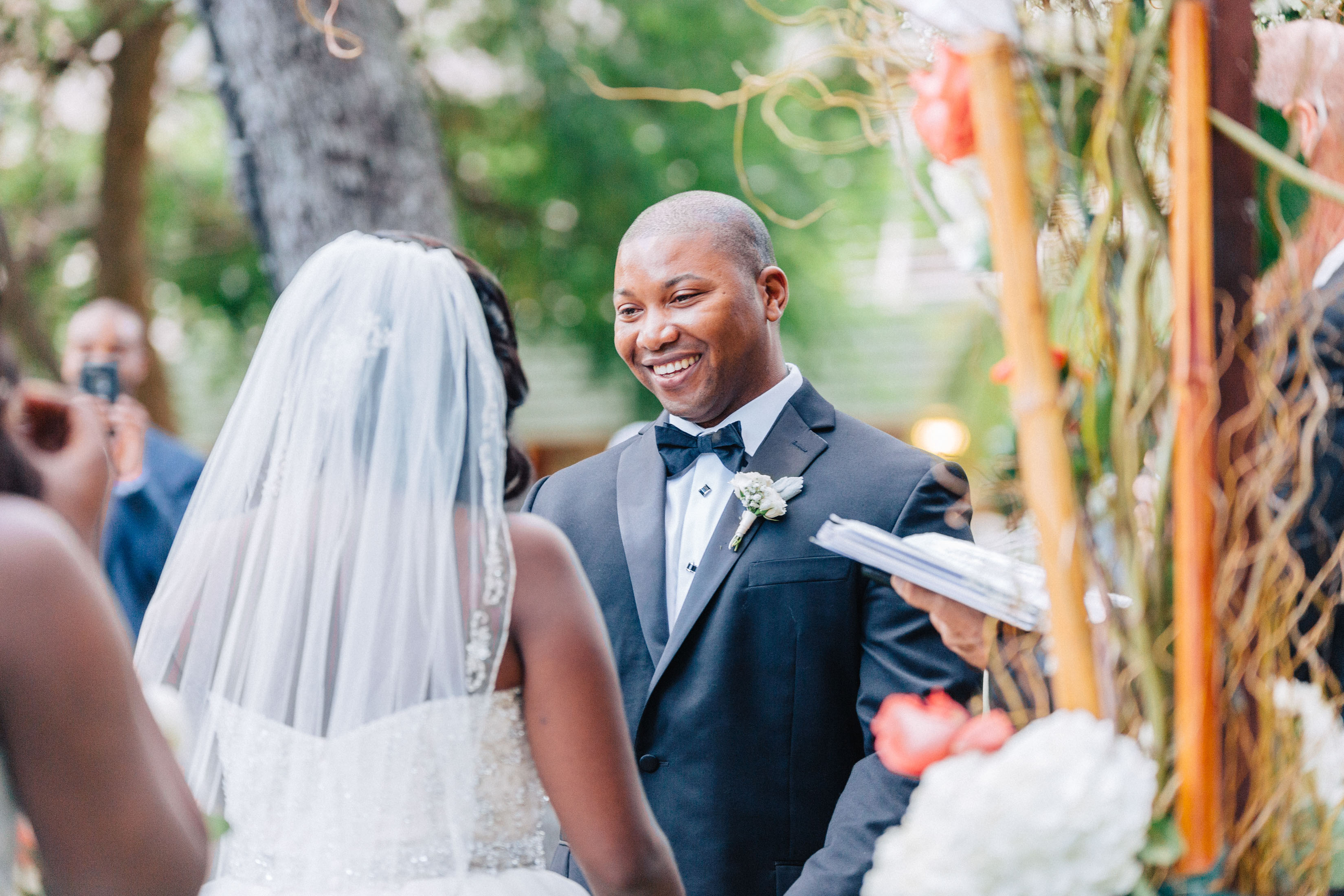 Groom smiling at bride